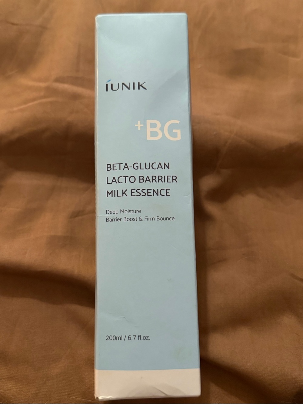 iUNIK Beta-Glucan Lacto Barrier Milk Essence in a 200 ml (6.7 fl. oz.) size